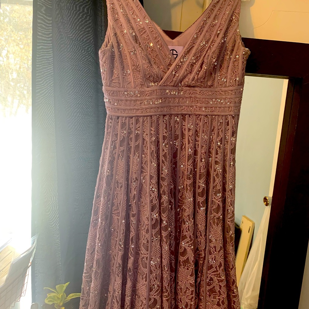 Beautiful Mother of the Bride dress. Mauve in color. Worn once. No alterations